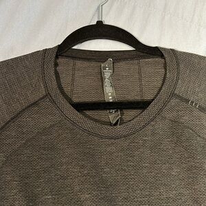 2 Large unisex shirts - one lulemelon and one sketchers - one blue one dark grey